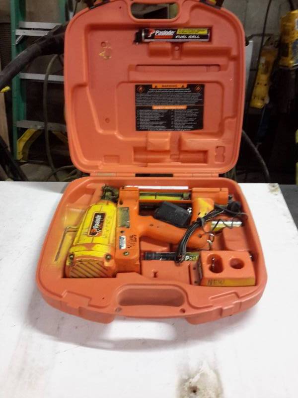 lot 65 image: Paslode, Impulse Staple Driver, 2 Fuel Cells, 1 Charger, 2 Batteries