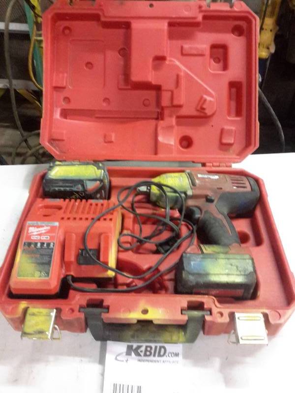 lot 69 image: Milwaukee 12 in Impact wrench 2, 18v batteries, 1 charger