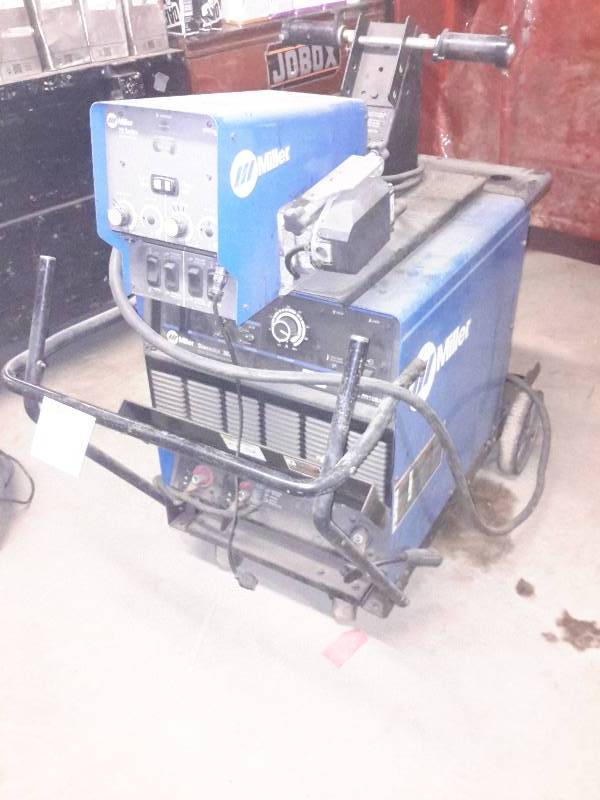 lot 5 image: Miller, Dimension 302, CCCV DC Welding Power Source  Miller, 70 Series Wire Feeder