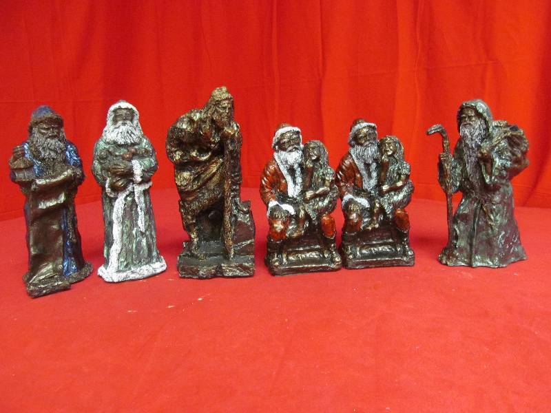 lot 66 image: hand cast Santas