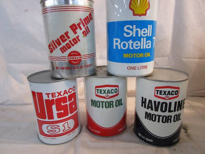 Various Oil Cans Full one is Paper and 4 are Metal