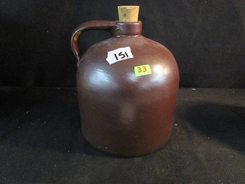 Medium Brown Jug Chip on the Lip