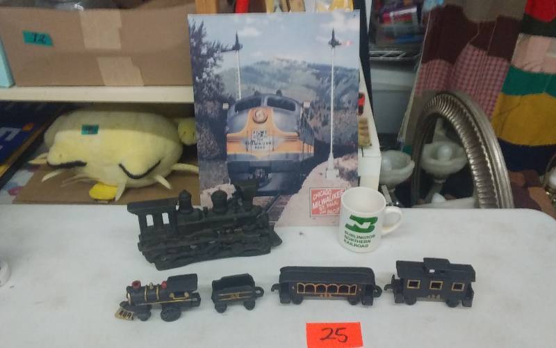 lot 25 image: Tin Rail Road Sign Chicago-Milwaukee, Cast Iron Train & Door Step