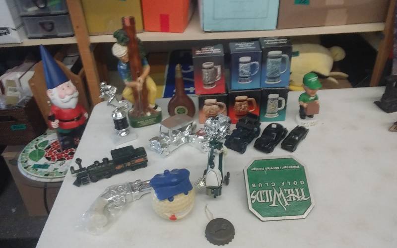 lot 26 image: Collection Of Avon Decanters, Cars, Steins, Train, Gun, Golf Decor & Liquor Decanter