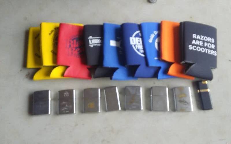 lot 47 image: Collection Of Zippo Lighters & Can Coozies