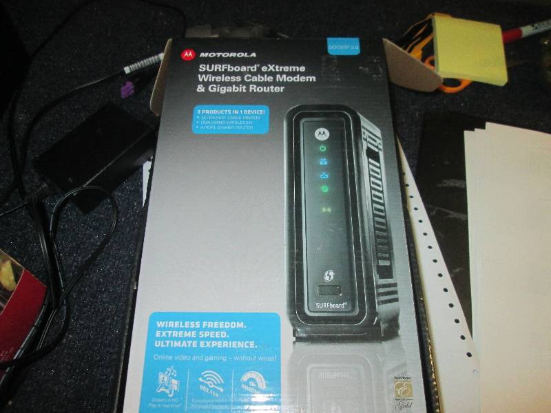 lot 46 image: motorolla sufboard extreme modem...
