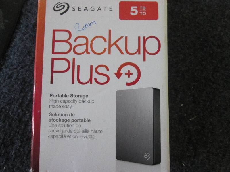 lot 75 image: seagate 5 gb external HD powers on...