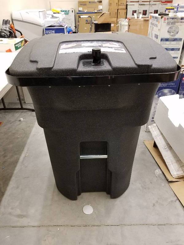 lot 132 image: Black bear tight wheeled trash can.