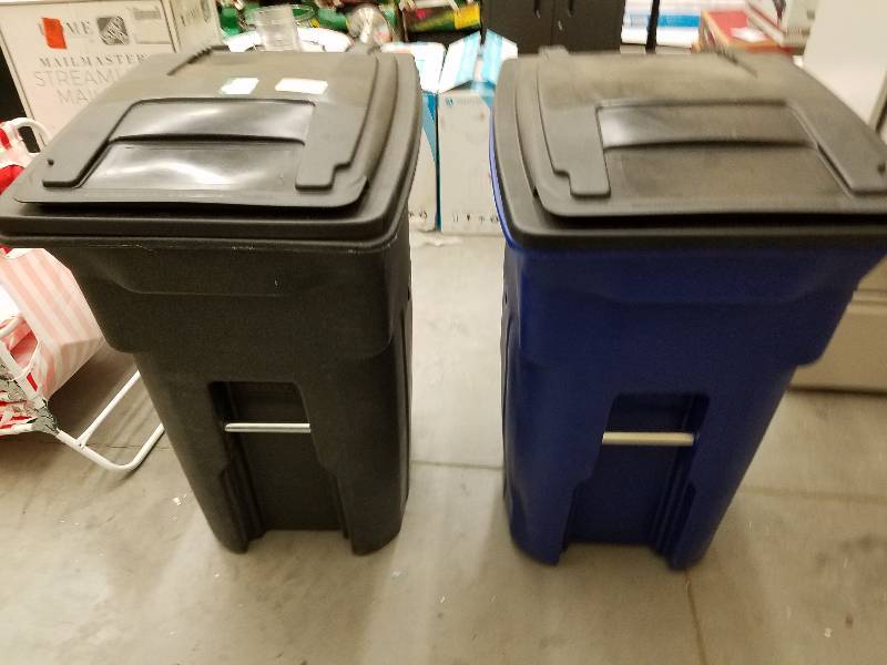 lot 133 image: Black and blue Toter 64 gal garbage cans