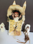 FUR WRAPPED PAPOOSE IN WOOD, FUR AND DOESKIN CRADLEBOARD