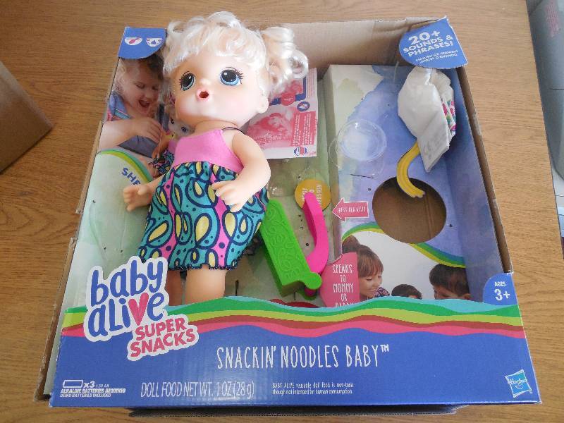 lot 141 image: Baby Alive Snackin Noodles Baby Doll - Blonde