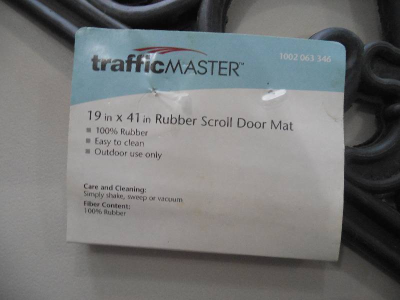 lot 78 image: (2) 19X41 RUBBER SCROLL DOOR MAT