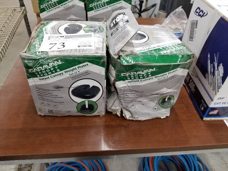 lot 73 image: Lot of (2) Caravan Canopy Sports Instant Canopy Weight Plates