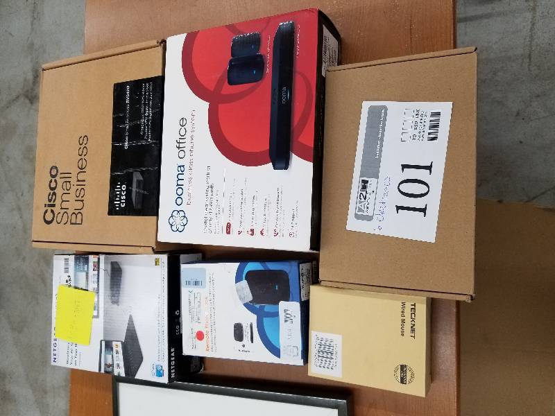 lot 101 image: Lot of (6) Electronics - Cisco Small Business Gigabit WAN VPN Router, Ooma Office Business Class Phone System, Cisco 2-Port Phone Adapter, Remote Phone Jack, Tecknet Wireless Mouse, Netgear Display