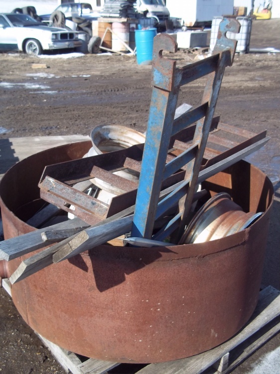 lot 6 image: Fire Ring with Rims and trailer ramps