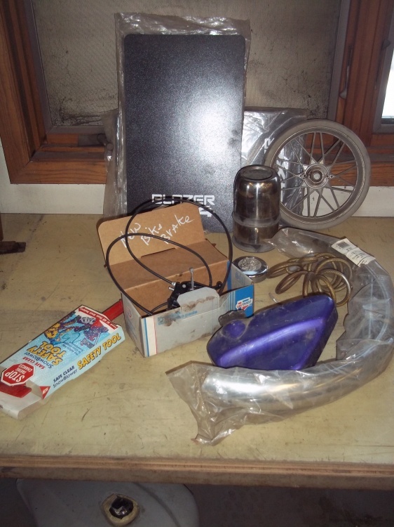 lot 12 image: Assorted Lot, Bike parts, Mud flaps and wheel, exit.