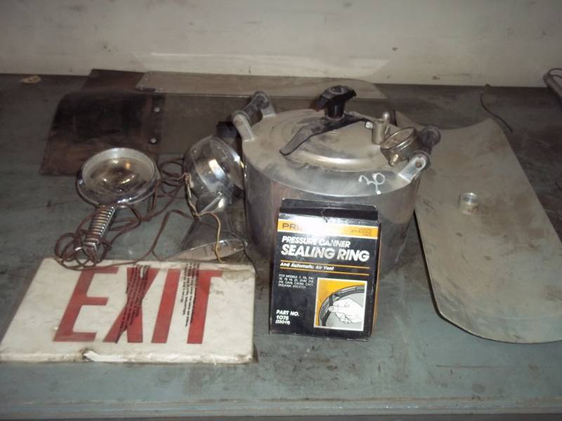 lot 15 image: Assorted Lot, Exit sign, Pressure cooker, Lights, boat parts.
