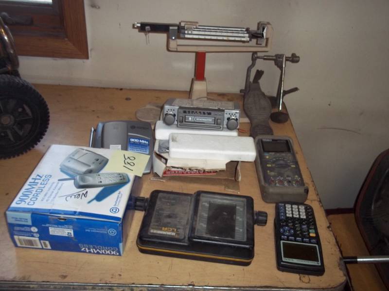 lot 20 image: Assorted lot with Scale, car radio, phone, and ext..