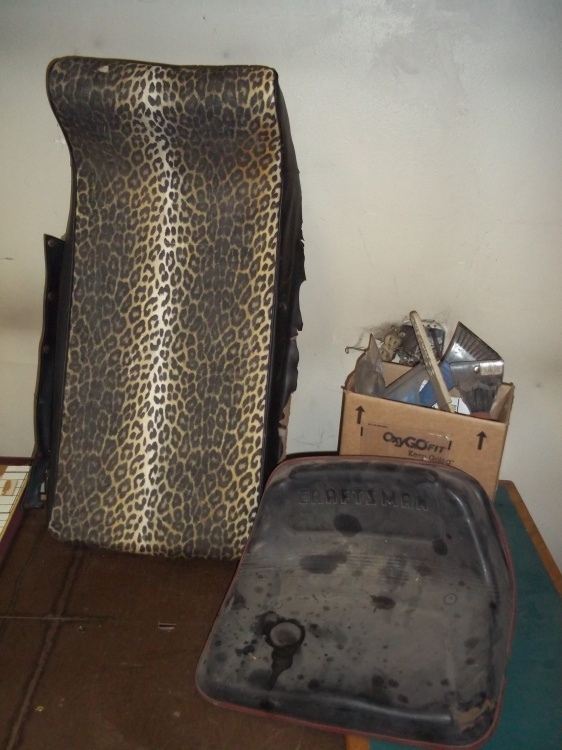 lot 23 image: Arctic cat seat, mower seat and ice scrapers