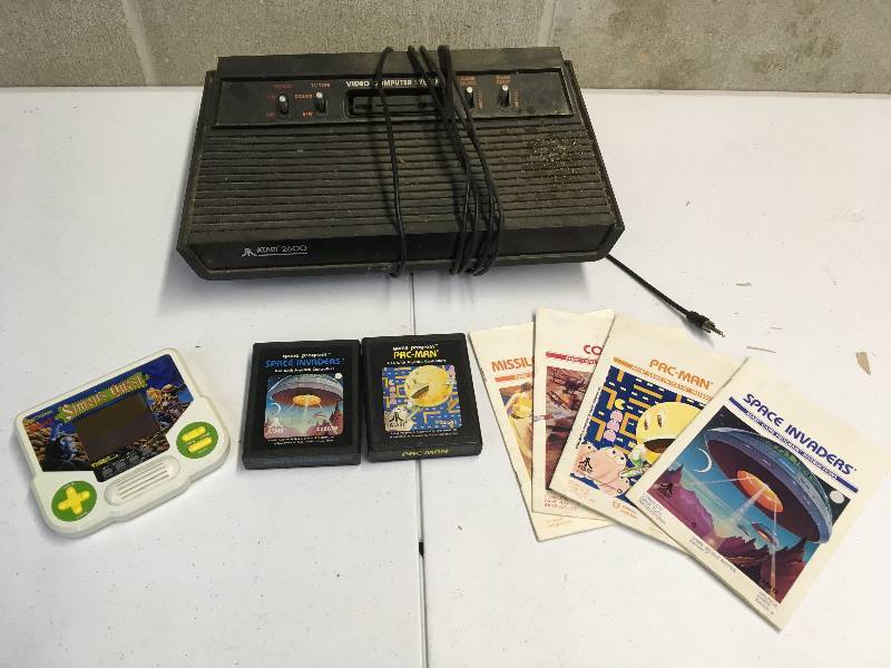 lot 44 image: Vintage Atari 2600  Pac Man and Space Invaders