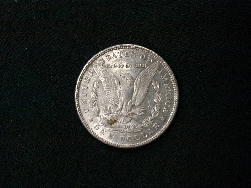 lot 9 image: 1884 Morgan Silver Dollar...