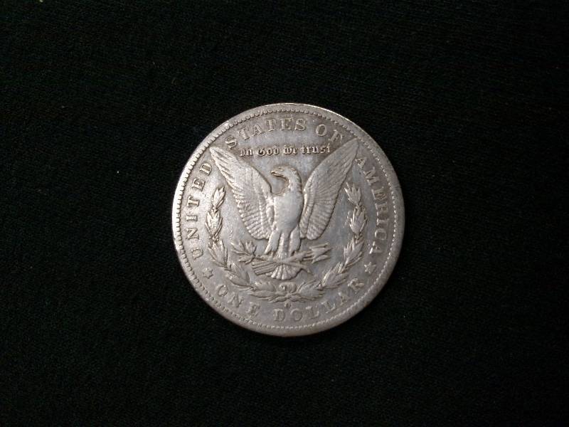 lot 10 image: 1885 O Morgan Silver Dollar...