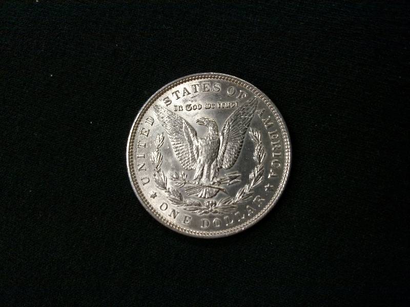 lot 11 image: 1886 Morgan Silver Dollar...