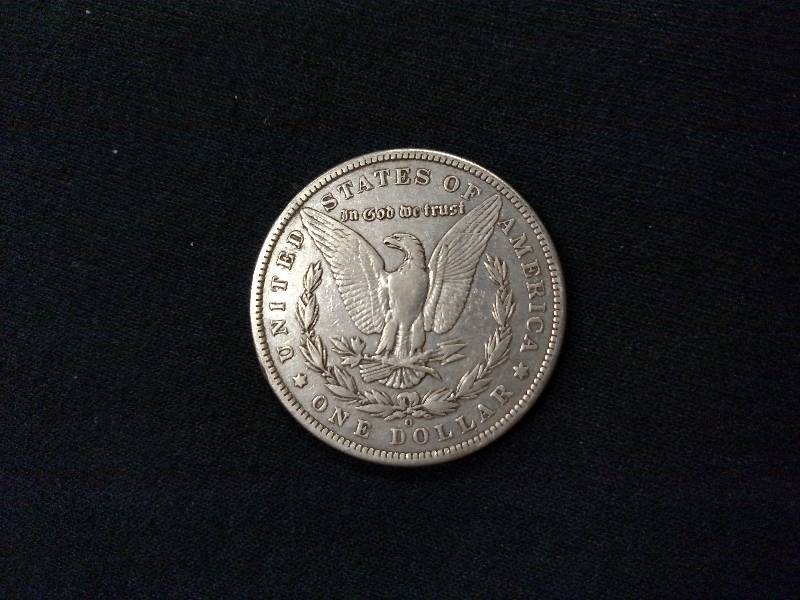 lot 12 image: 1886 O Morgan Silver Dollar...