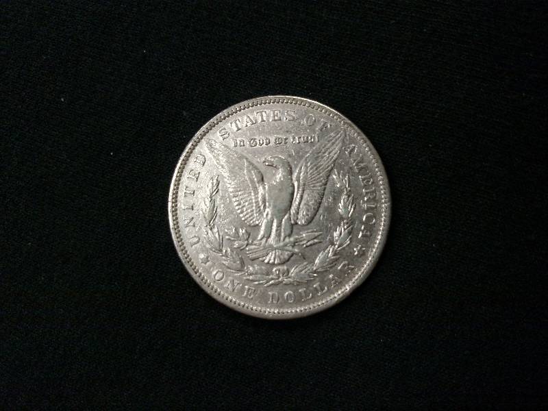 lot 16 image: 1890 Morgan Silver Dollar...