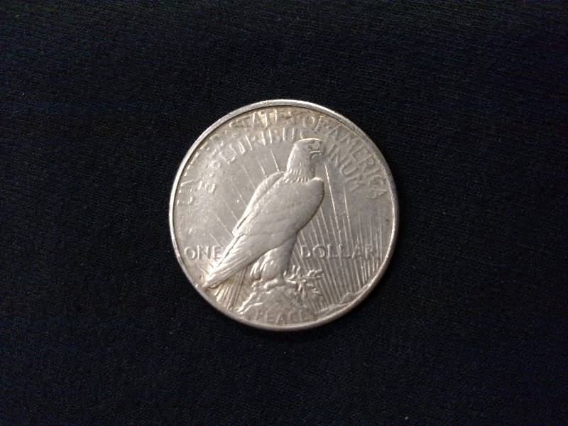 lot 64 image: 1923 S Peace Silver Dollar...