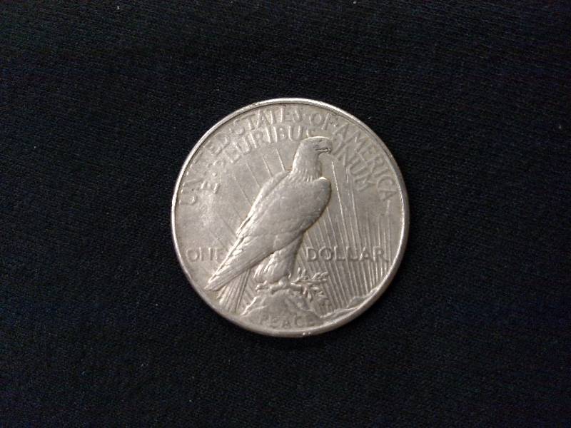 lot 70 image: 1925 Peace Silver Dollar...