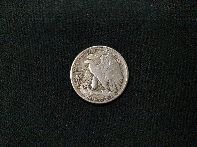 lot 107 image: 1945 Walking Liberty Silver Half Do...