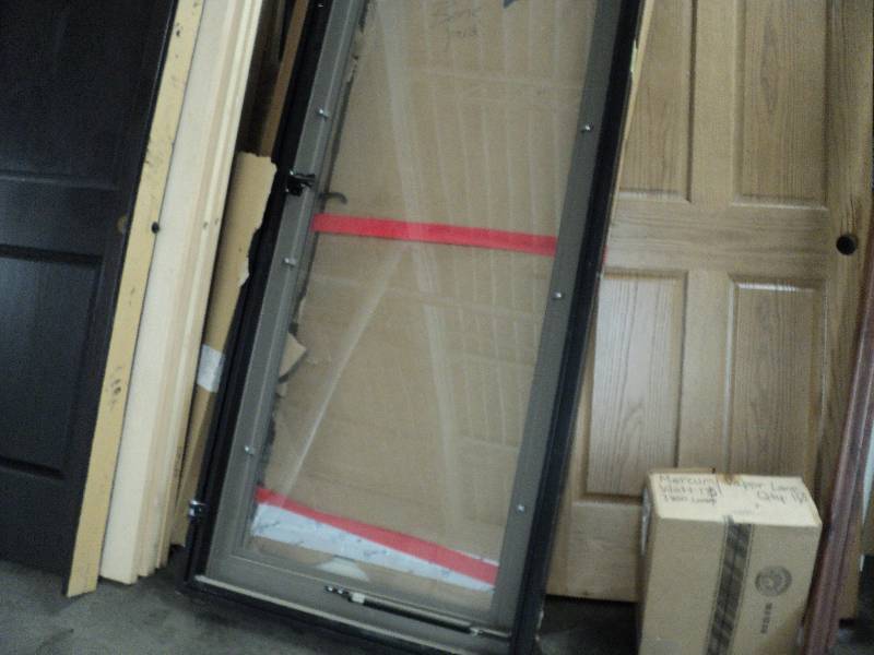 lot 93 image: 30x79 glass door in frame...