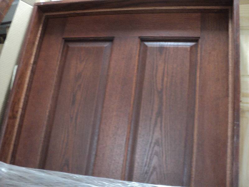 lot 138 image: 29x78 stained wood door in a frame...