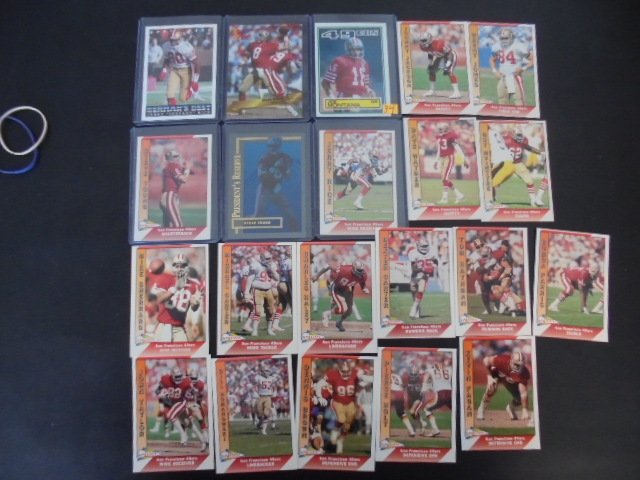 lot 34 image: Vintage 49ers Football Cards With Montana, Rice and Young