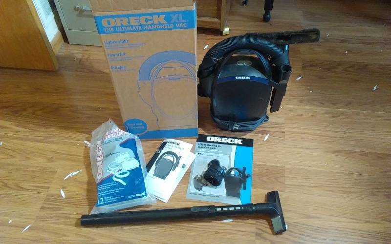 lot 23 image: Oreck XLCC1600 Hand Held Vac & Attachments
