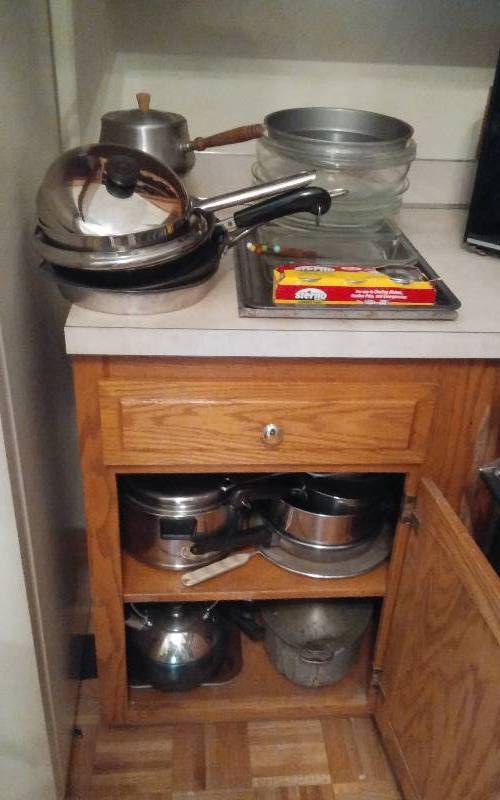 lot 32 image: Cupboard With Pots, Pans, Lids, Cookware, Bakeware, Kenmore Microwave