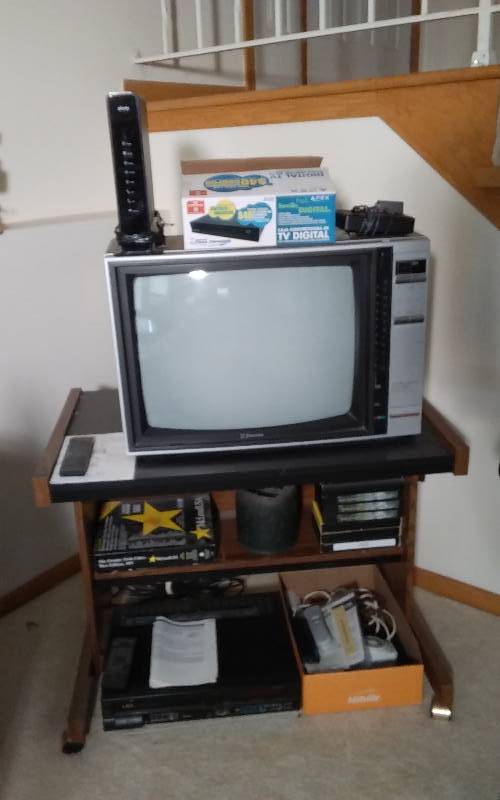 lot 40 image: Emerson TV, Converter Box, VCR, Xfinity Cable Box, Remotes, Rolling Stand