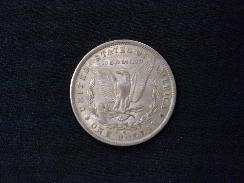 lot 14 image: 1885 O Morgan Silver Dollar...