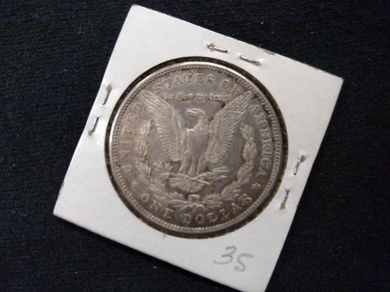 lot 26 image: 1897 S Morgan Silver Dollar...
