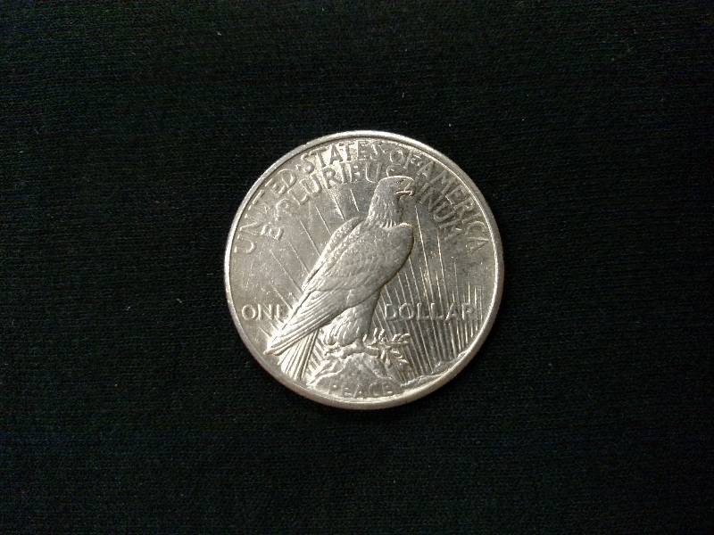 lot 61 image: 1925 Peace Silver Dollar...