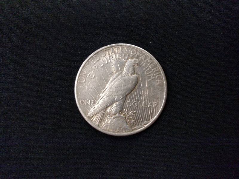 lot 62 image: 1925 Peace Silver Dollar...