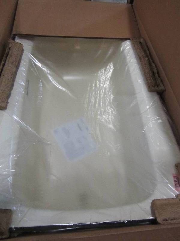 lot 59 image: American Standard Cambridge 5 ft. x 32 in. Left Drain Soaking Bathtub in biscut