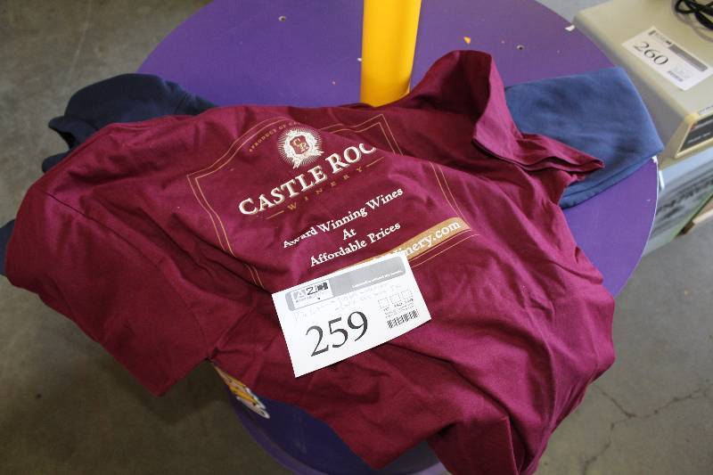lot 259 image: Clothing - Fireball Windbreaker, Castle Rock Wine Tee