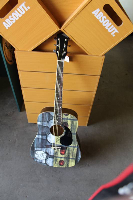lot 304 image: Titos Vodka Promotional Guitar
