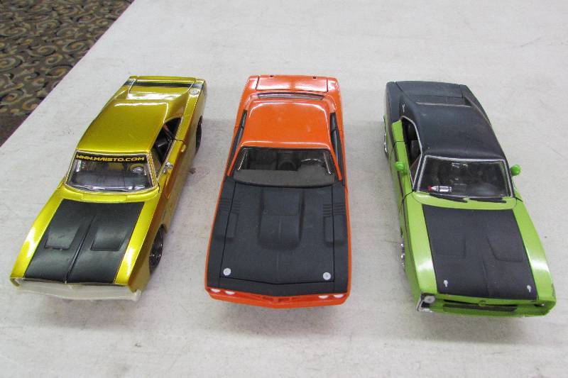 THREE COLLECTIBLE METAL CARS