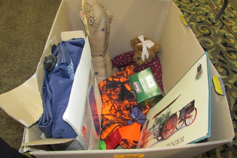 BOX OF MISC HOUSEHOLD. AIR MATTRESS AND PUMP, METAL SIGN, HUNTERS VEST, TOY DINO, AND MORE