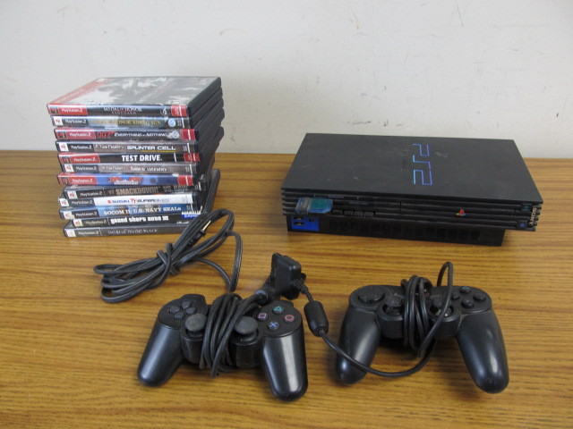 lot 81 image: Working Playstation 2 Console Controllers & Games