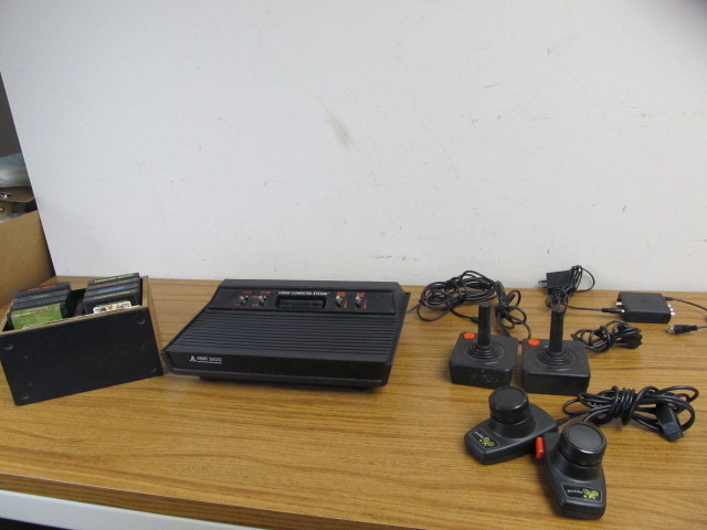 lot 82 image: Working ATARI 2600 Console wJoysticks Paddles & Games