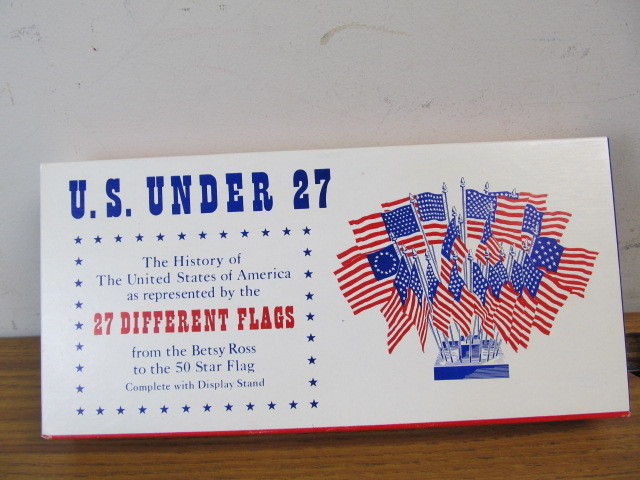 lot 27 image: NEW IN BOX Vintage U.S. Under 27 Flag Set